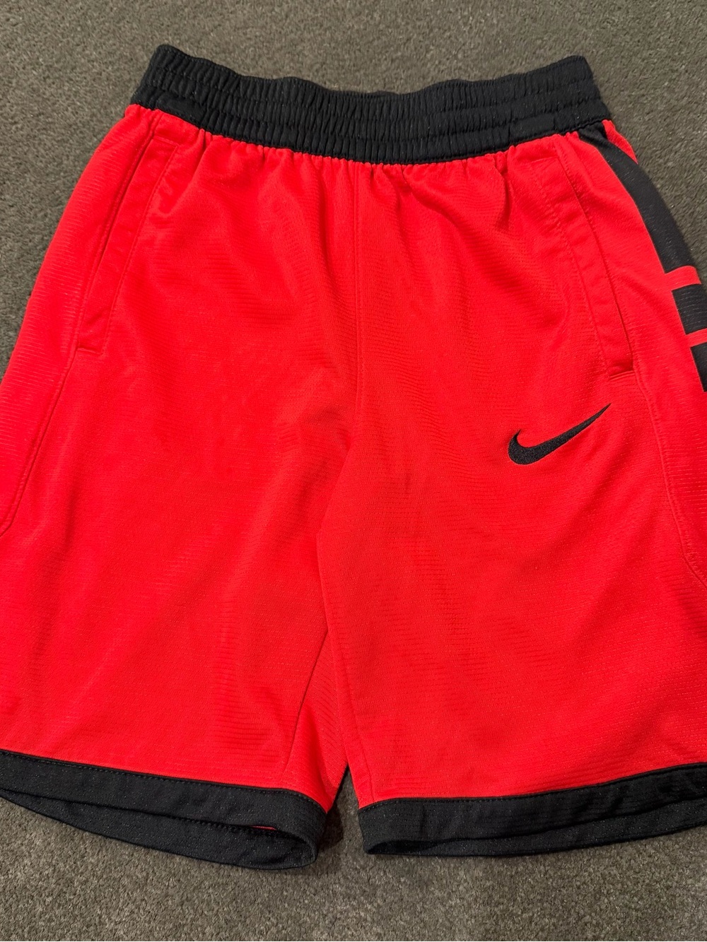Nike Men's Red Athletic Shorts with Black Waistband and Trim